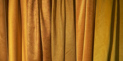 dense textile and boucle textile which are golden in color background, texture