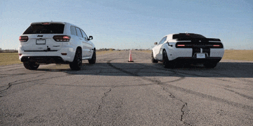 Watch the Jeep Grand Cherokee Trackhawk Ruin a Widebody Challenger Hellcat in a Drag Race