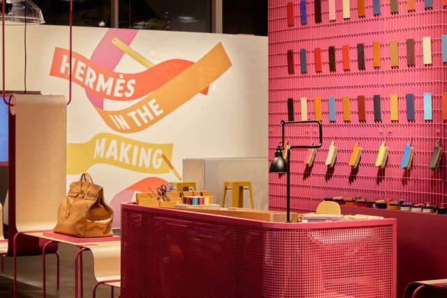 a photo of the heremes detroit exhibit hermès in the making including a used birkin bag and swatches of leather in detroit 2022