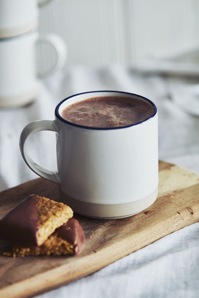 high angle close up of mug of hot chocolate and biscuits