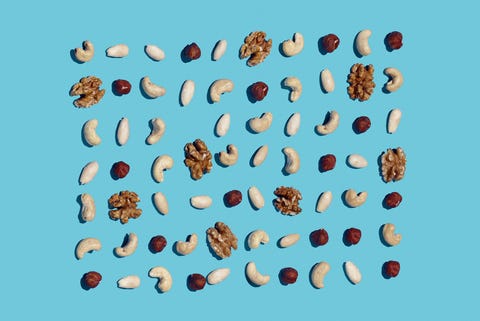 High angle view of nuts on blue background High angle view of nuts on blue background