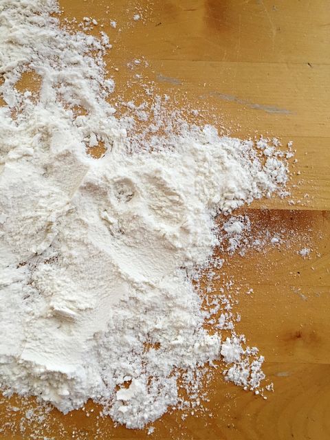 High Angle View Of Baking Soda On Wooden Table