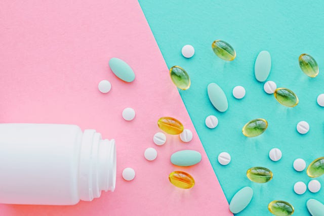 high angle view of bottle with medicines on table