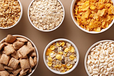 High Angle View Of Breakfast Cereals Served In Bowls On Table