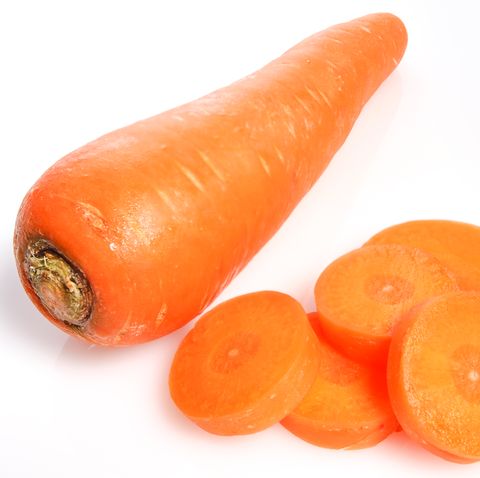 high angle view of carrot with slices against white background
