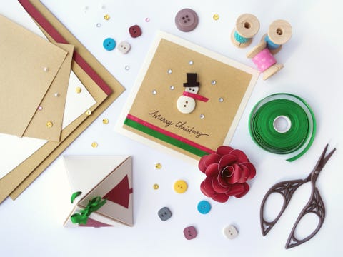 High Angle View Of Christmas Present And Craft Products On Table