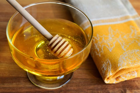 High Angle View Of Honey In Container On Table