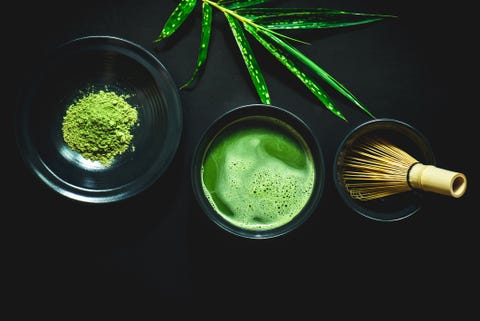 High Angle View Of Matcha Tea Against Black Background High Angle View Of Matcha Tea Against Black Background