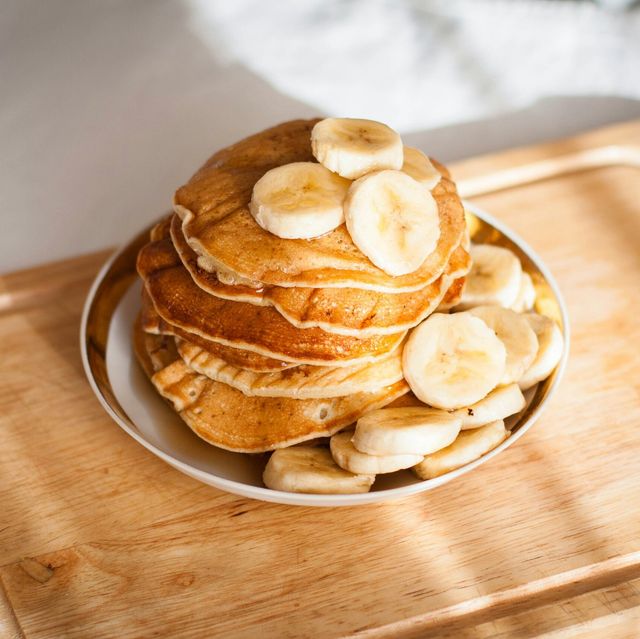 high angle view of pancakes with banana in plate on table
