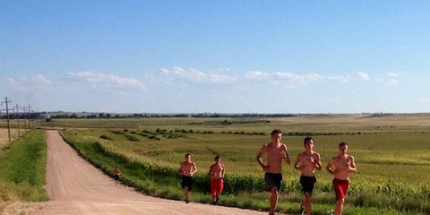 Boys Running on Dirt Road