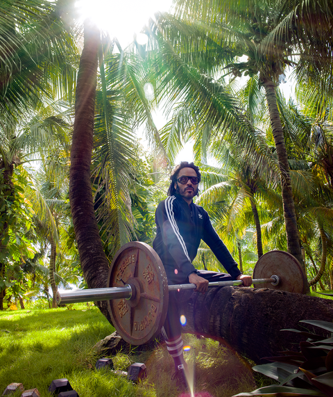 kravitz with weights on coconut tree