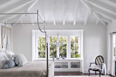 bedroom, white wooden beams, copper bed frame, window ledge and seat