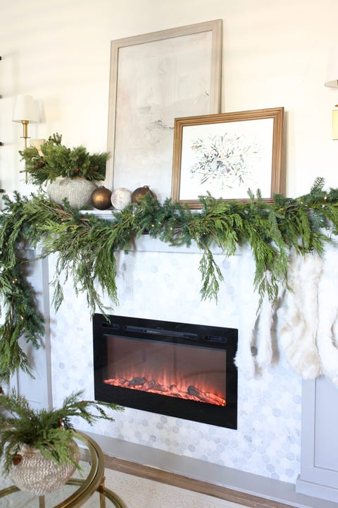 overflowing garland christmas mantel decor