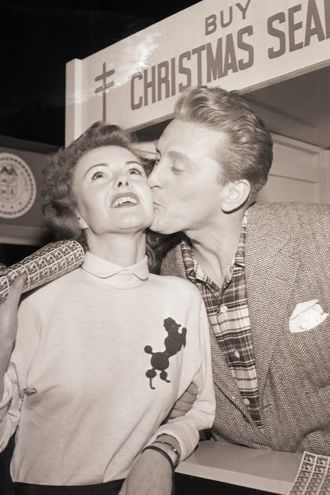 Kirk Douglas Kissing a Seal Customer