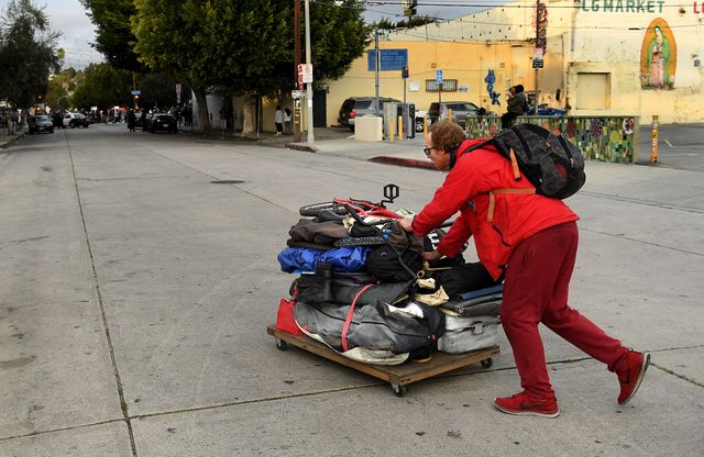 los angeles california march 25, 2021 charles mcknight moves his belongings along logan st before lapd officers evict the homeless in echo park thursday wally skalijlos angeles times