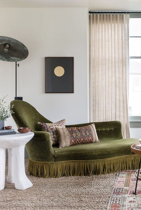 living room with green chaise