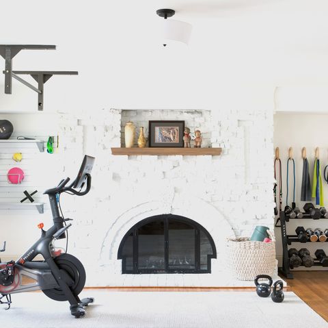 contemporary home gym with fireplace