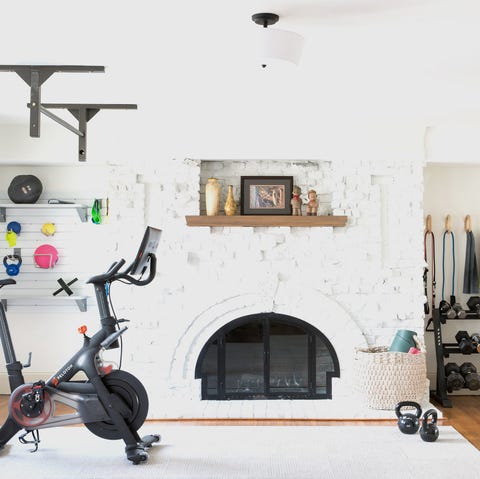 contemporary home gym with fireplace