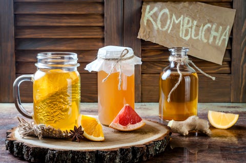 Homemade fermented raw kombucha tea with different flavorings. Healthy natural probiotic flavored drink.