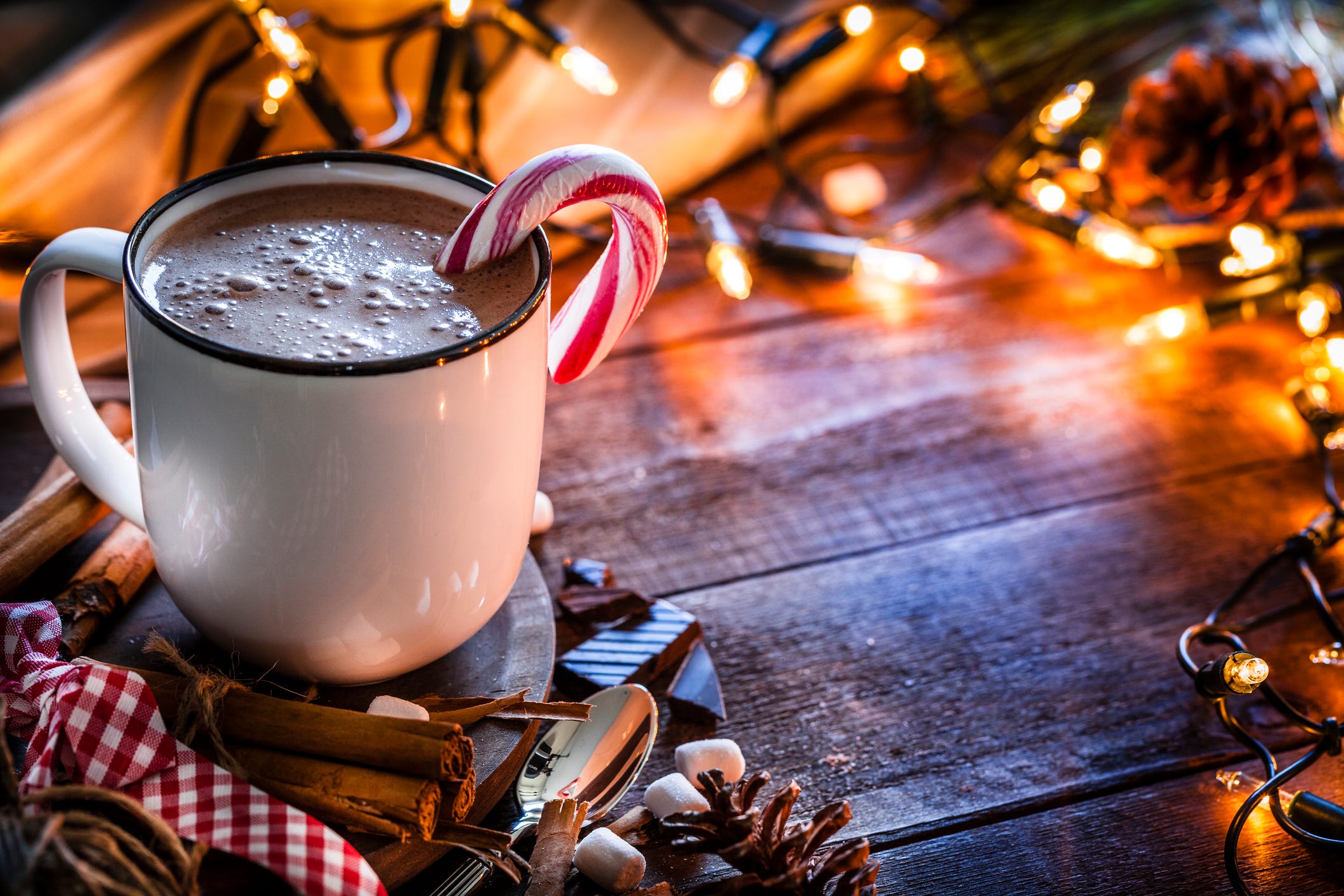 Hememade hot chocolate mug shot on rustic wooden Christmas table