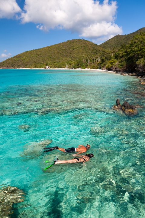 honeymoon couple snorkeling in the caribbean crystal clear waters