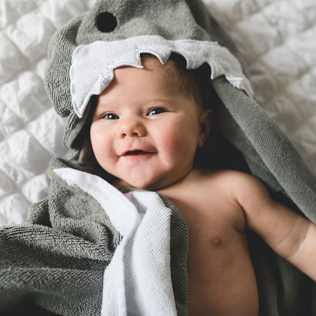 baby wearing shark hooded bath towel