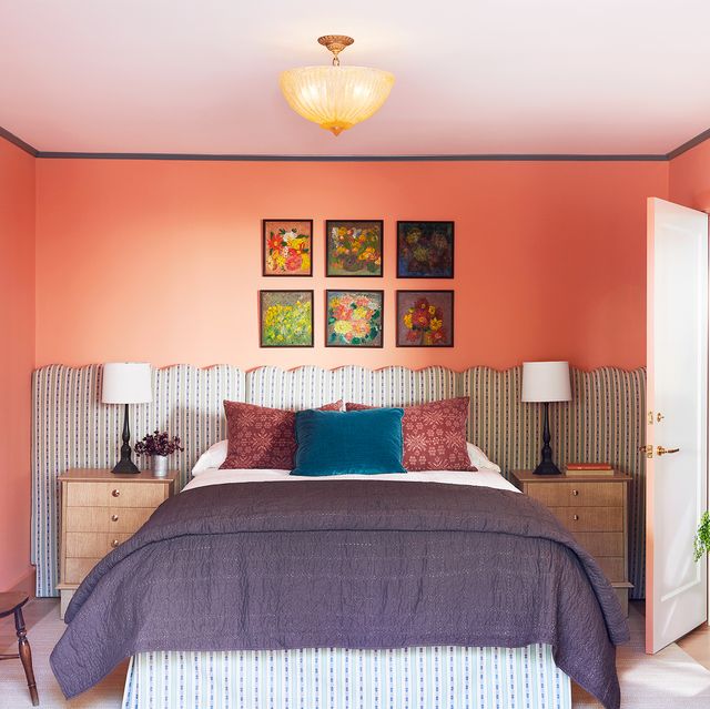 coral bedroom with fabric headboard