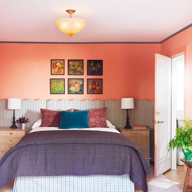 coral bedroom with fabric headboard