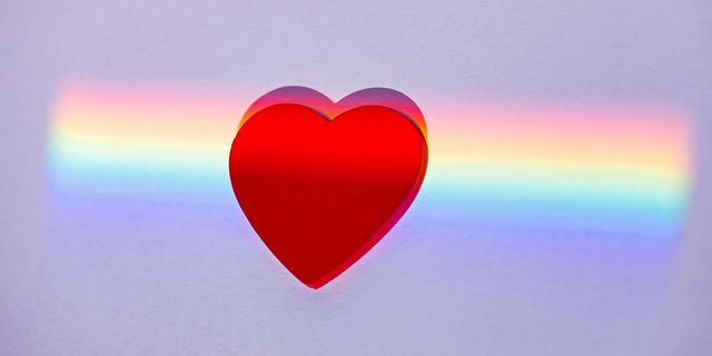 a heart against a rainbow background