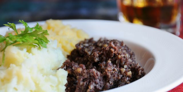 scottish meal of haggis, neeps and tatties and of course a wee dram narrow depth of field on haggis traditional meal for rabbie burns night