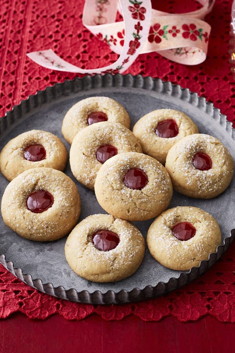 almond raspberry thumbprint cookies on metal tray