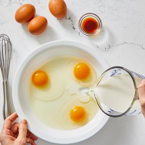 eggs and milk mixed together in a pan