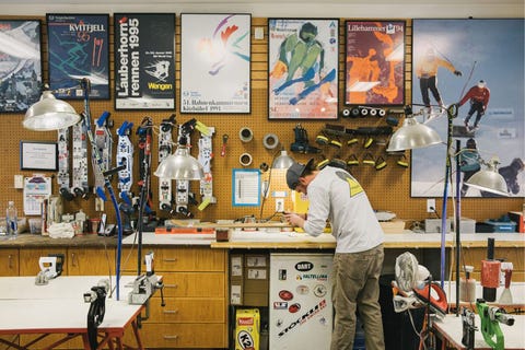 man waxing his skis
