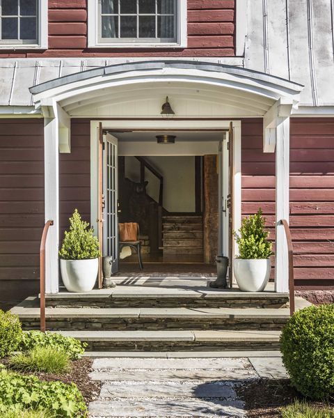 entry of red converted dairy barn farmhouse