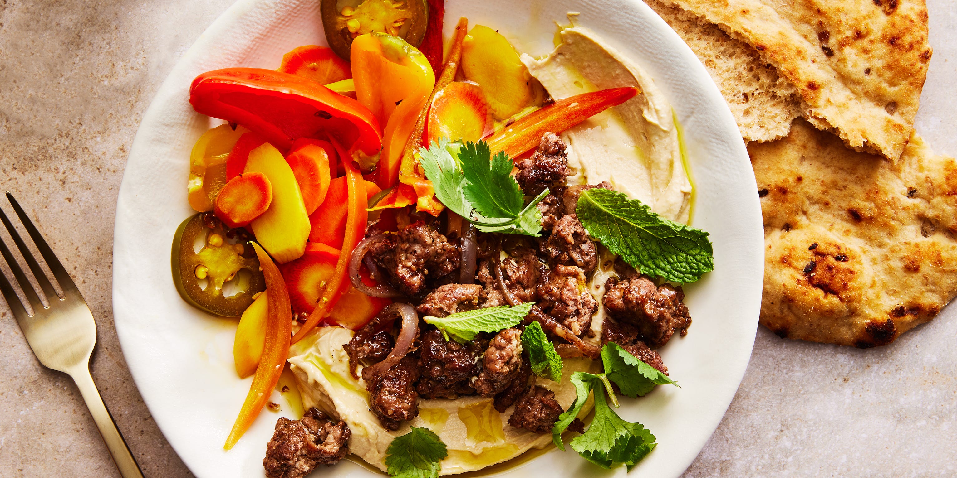 Our Hummus Bowl With Spiced Lamb & Pickled Veggies Is Better Than Your Go-To Takeout Lunch