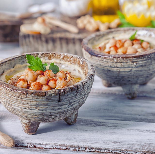 Hummus topped with whole chickpeas and olive oil. hummus topped with whole chickpeas and olive oil
