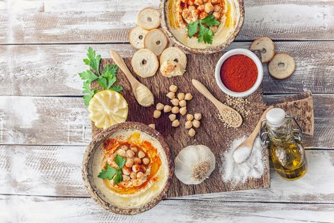 Hummus topped with whole chickpeas and olive oil.