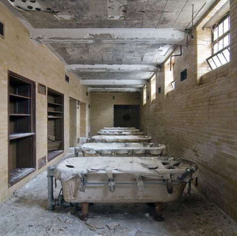 creepy abandoned hospital hydrotherapy tubs