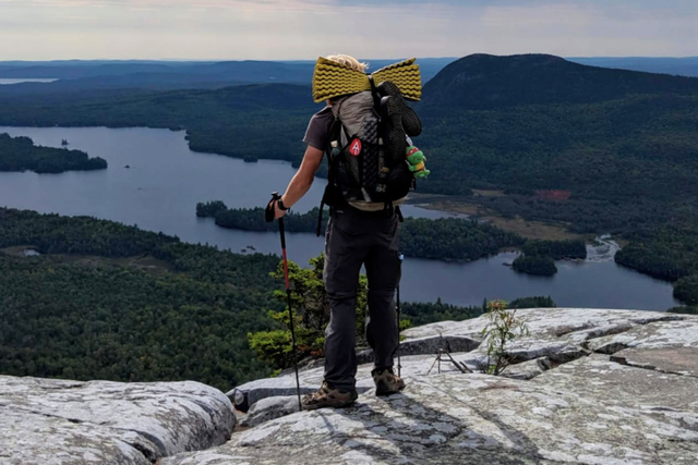 person hiking with backpack