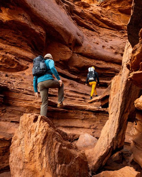 two hikers hiking through canyon wearing hyperlite mountain gear elevate 22 backpack