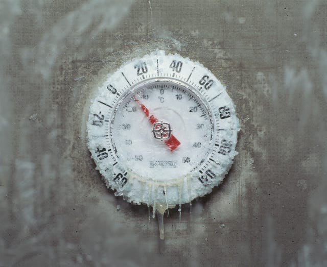 coldest temperature ever ice covered thermometer, close up