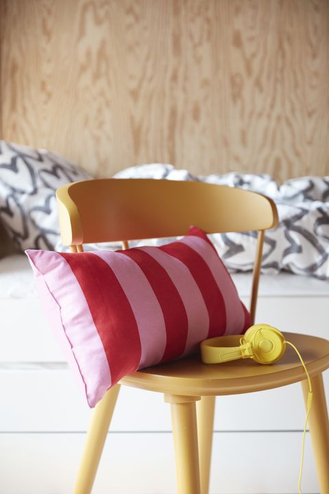 the new red and pink striped sarakajsa cushion is filled with recycled polyester