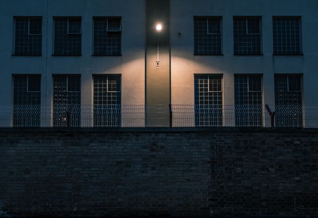illuminated lighting equipment mounted on prison building