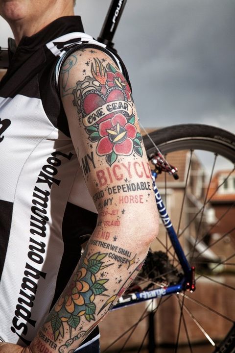 Tattoo, Arm, Human leg, Leg, Joint, Bicycle drivetrain part, Temporary tattoo, Human body, Hand, Bicycle part, 