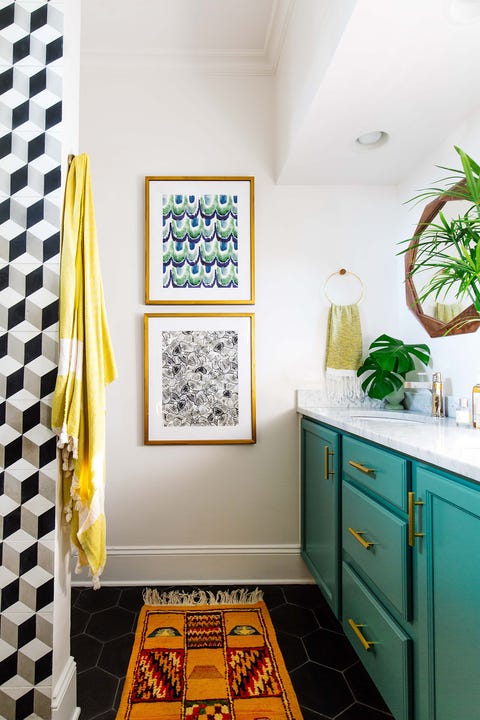 teal cabinets, black flooring, patterned rug, fake plants