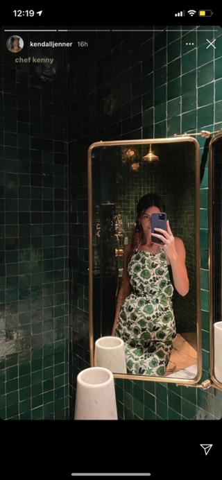 kendall jenner wears festive green apron while cooking with hailey baldwin