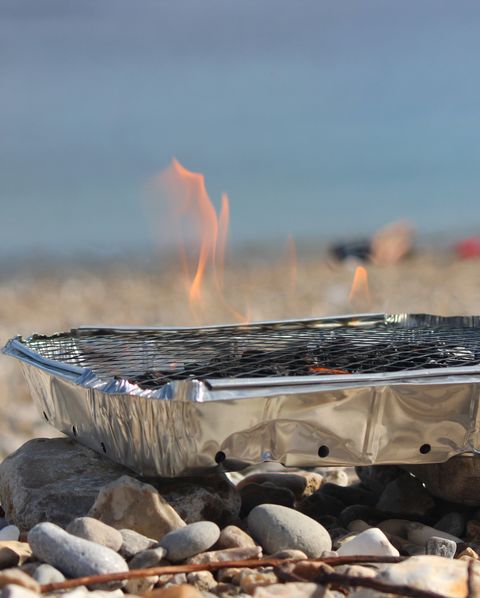 disposable barbecue, charcoal bbq on beach