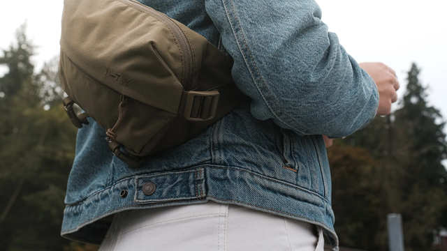 moment mtw fanny sling 2l on person in jean jacket's back outside