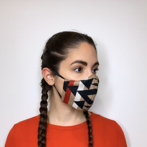 indigenous fashion designer korina emmerich models one of her masks