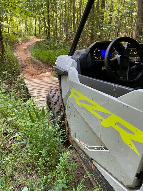 polaris rzr trail on a narrow wooden bridge